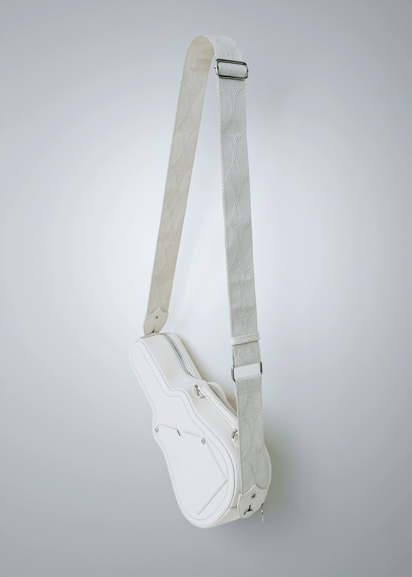 White (Ivory) Mary and Shelley Ritual Crossbody Bag with adjustable cotton jacquard strap, shown hanging to display guitar case-inspired shape.